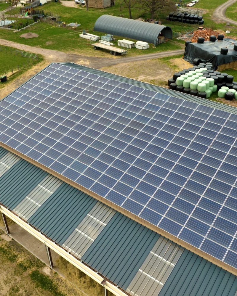 aerial-view-of-farm-building-with-photovoltaic-sol-2024-12-07-02-58-44-utc-min